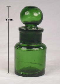 Small green cosmetic bottle with glass stopper; click to enlarge.
