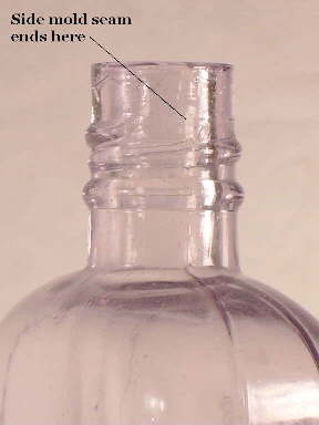 Early 20th century mouth-blown liquor flask with external screw threads.