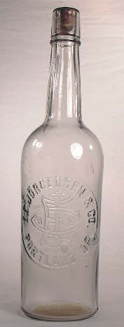Early 20th century mouth-blown liquor bottle; click to enlarge.